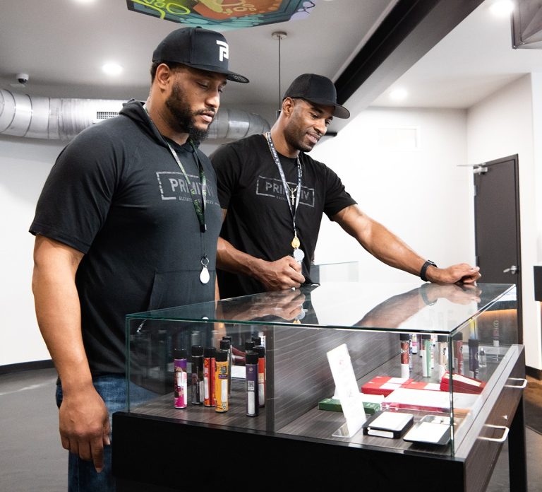 Primitiv Group co-founders Rob Sims and Calvin Johnson Jr. inside their Niles dispensary's product showcase room-web